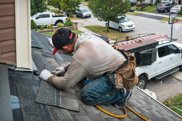Professional Storm Damage Roof Repair technician working in Fairfax, OK